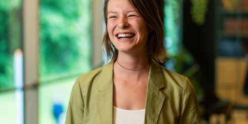 Woman smiling to her collegues 