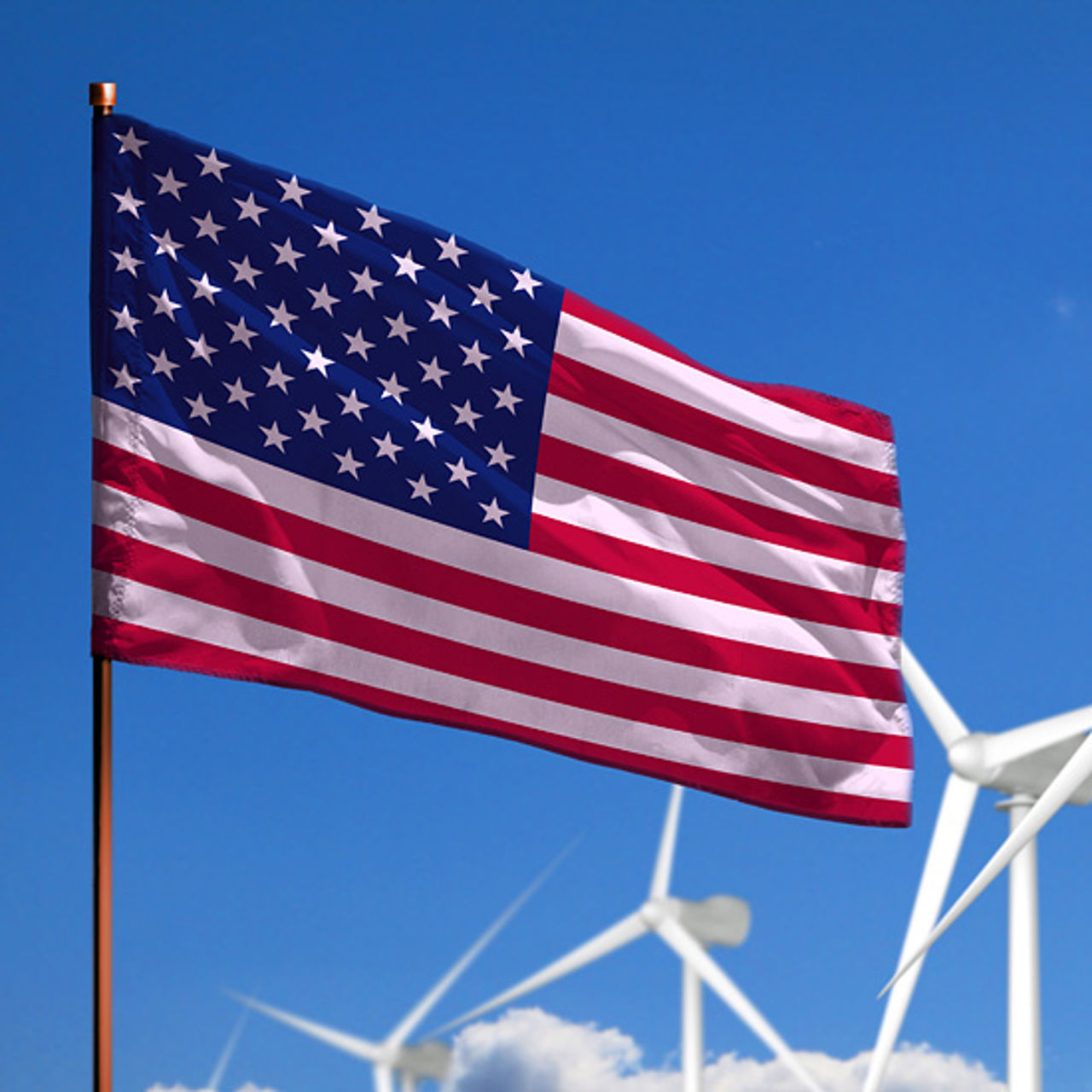 American flag with wind turbines in  the background